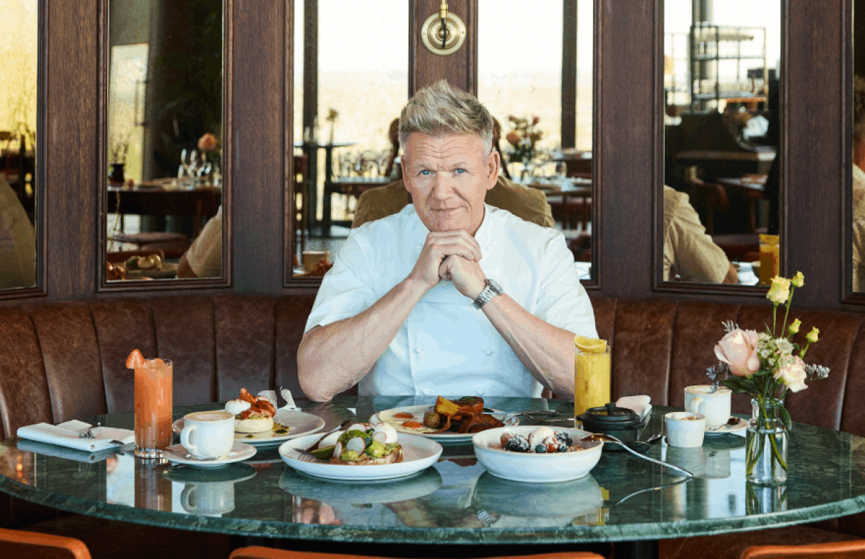 GRR BSK BG APRIL 2026 GORDON SITTING IN BOOTH WITH BREAKFAST MENU ITEAMS LANDSCAPE STILL PICTURE TABLET