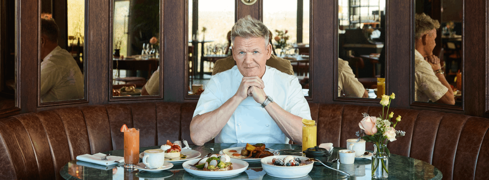 GRR BSK BG APRIL 2026 GORDON SITTING IN BOOTH WITH BREAKFAST MENU ITEAMS LANDSCAPE STILL PICTURE DESKTOP