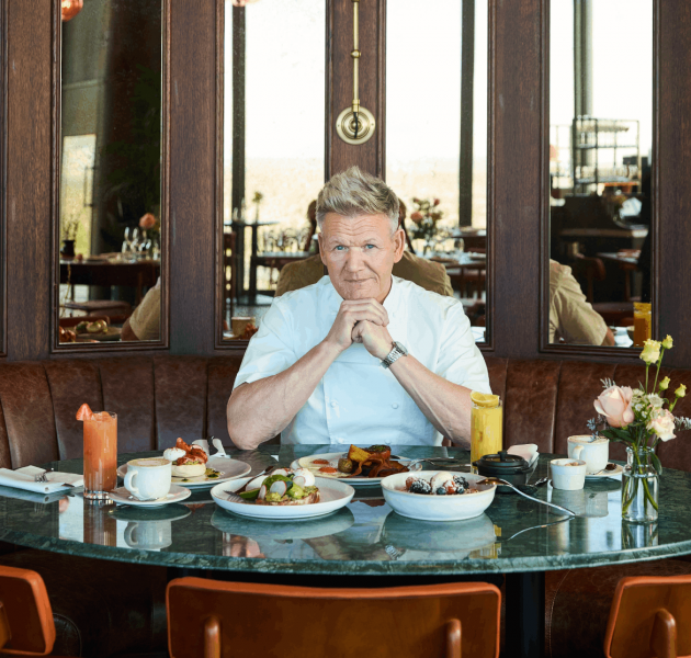 GRR BSK BG APRIL 2026 GORDON SITTING IN BOOTH WITH BREAKFAST MENU ITEAMS LANDSCAPE STILL PICTURE MOBILE