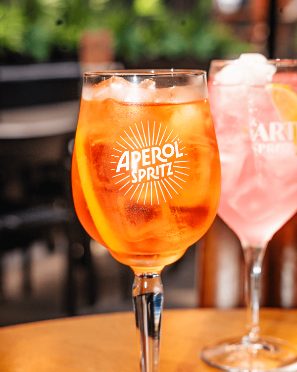 Glasses of Aperol spritz and Sarti spritz
